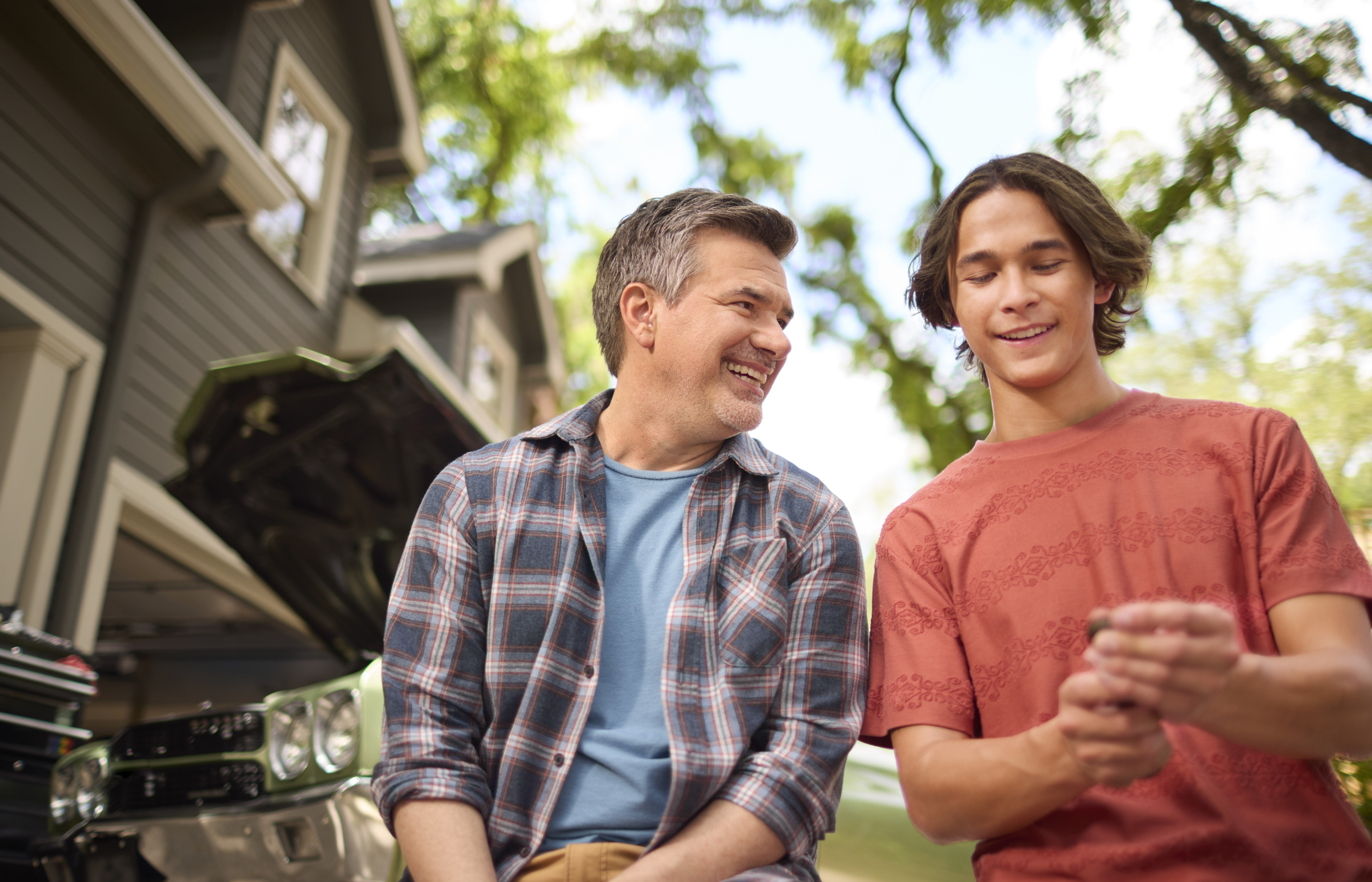 Father son family car tools smiling