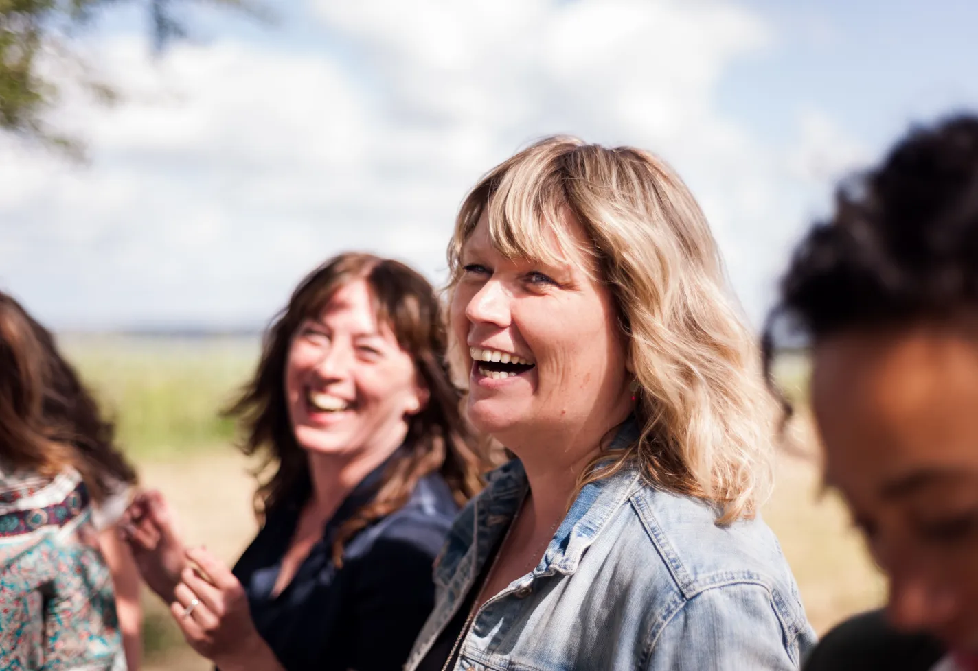 Mature Female Friends Socializing In the Backyard Together