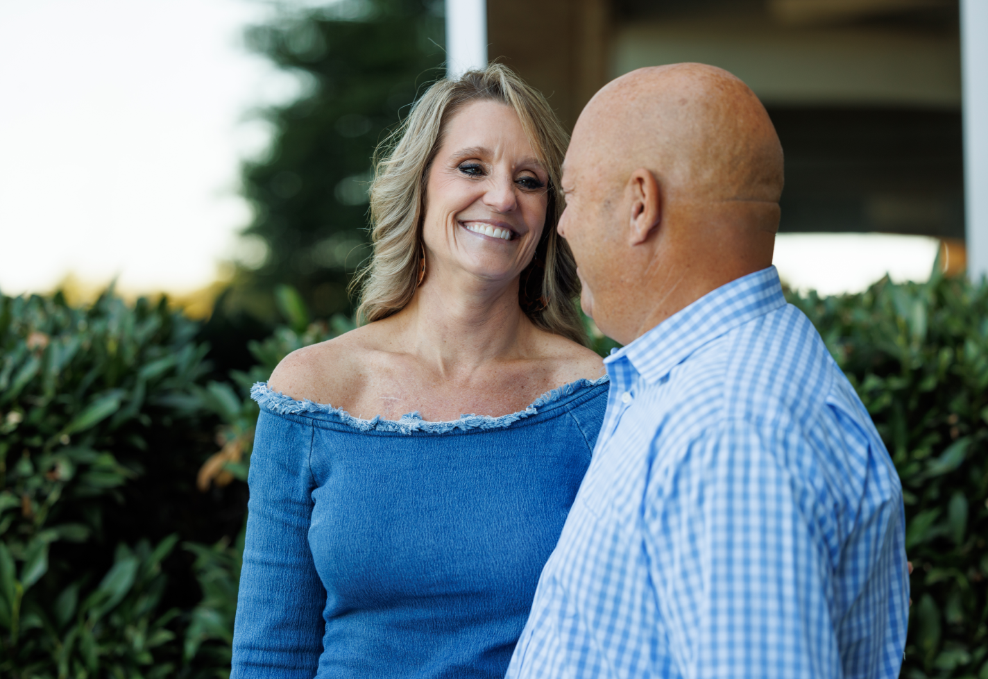 Traci George and her husband smiling