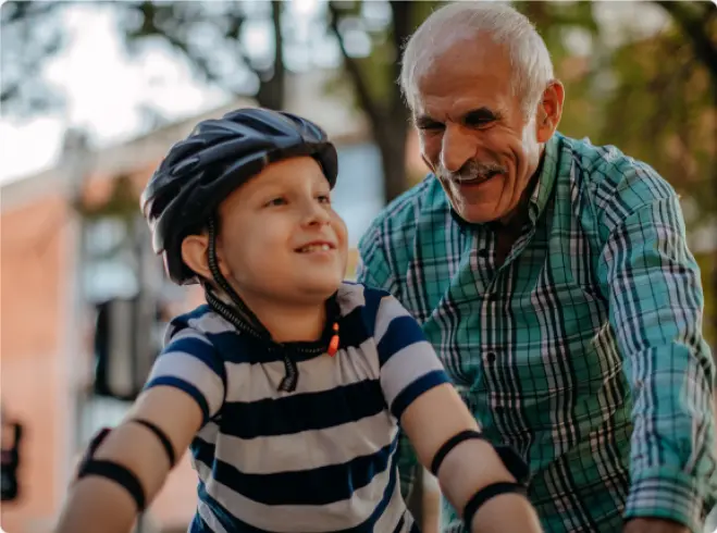 Grandfather and child on a family bike ride