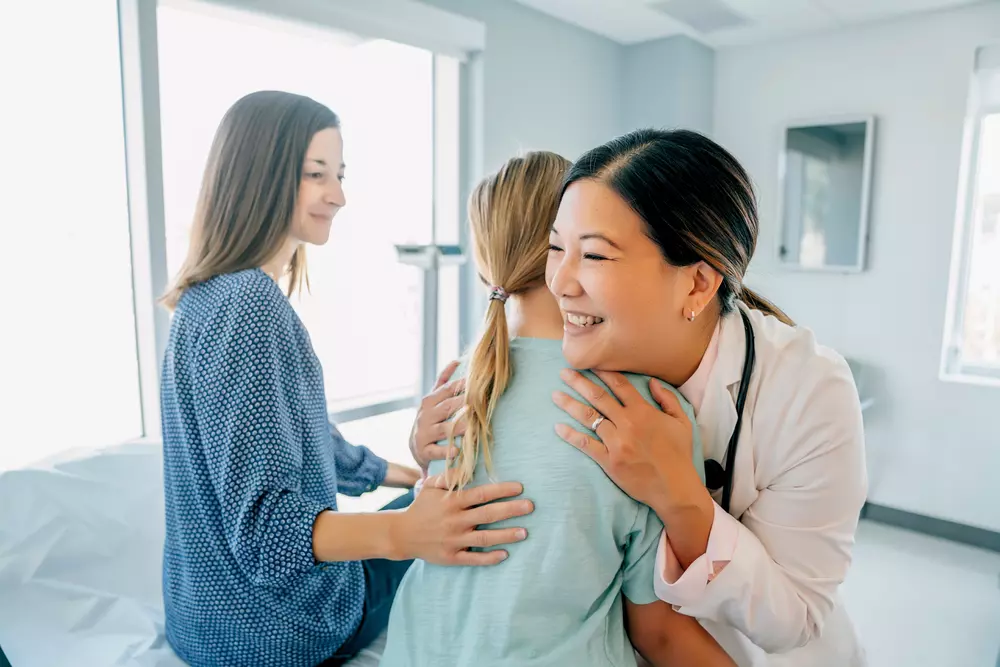 Team Member Hugging Patient