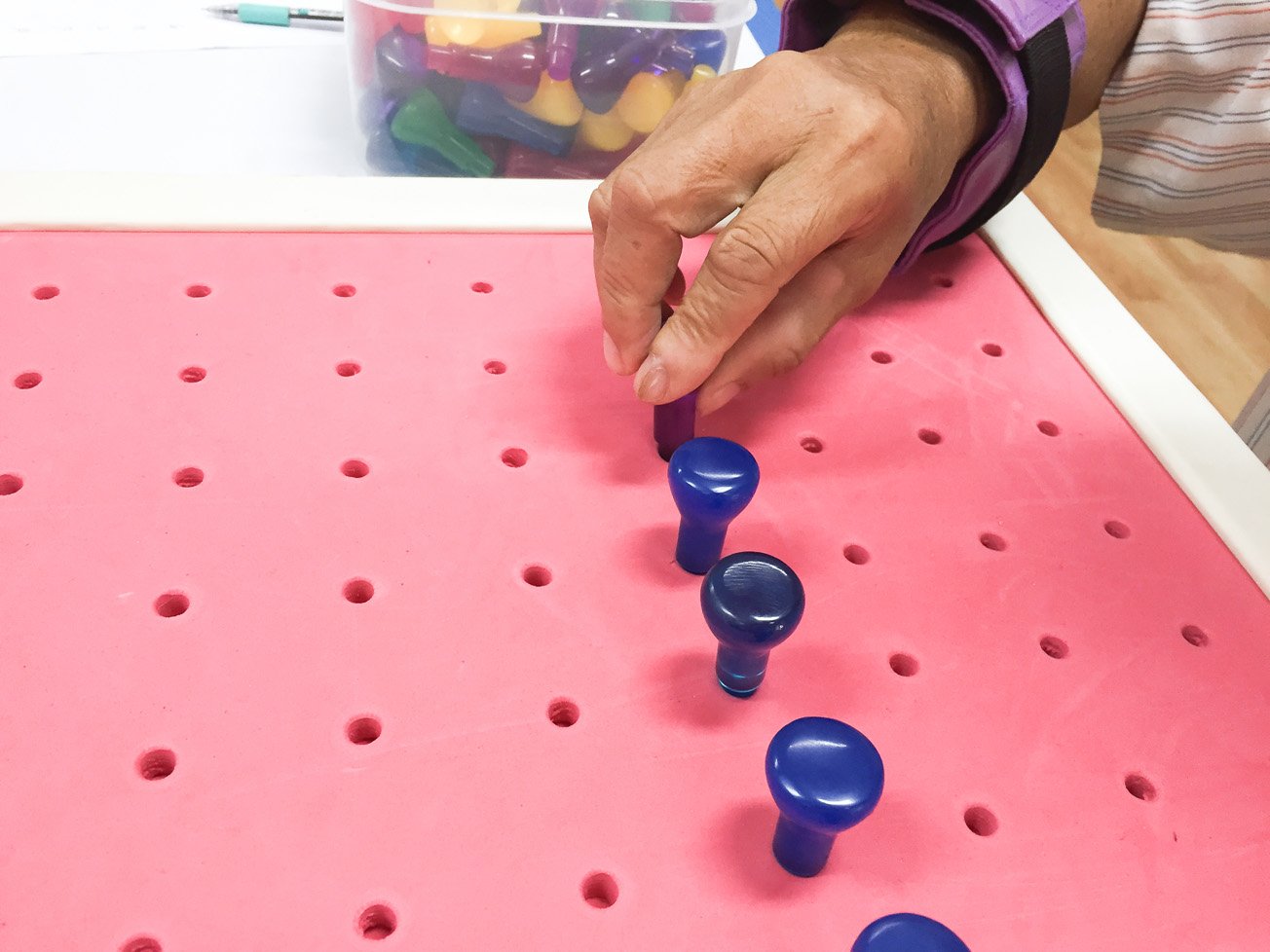 Hand Therapy using a peg board