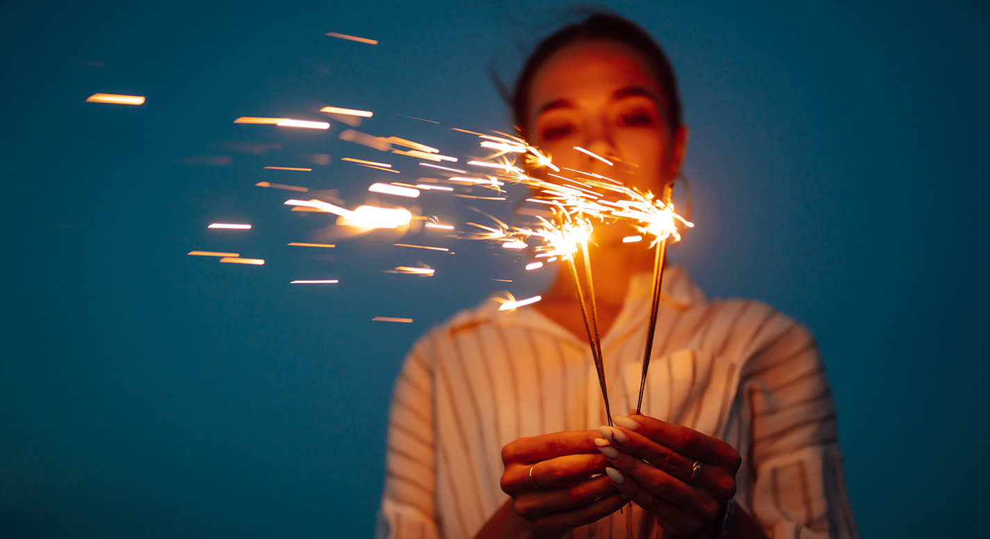 A woman holding some fireworks