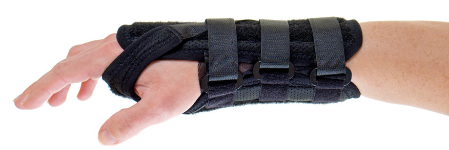 A man's hand and wrist in a wrist brace.